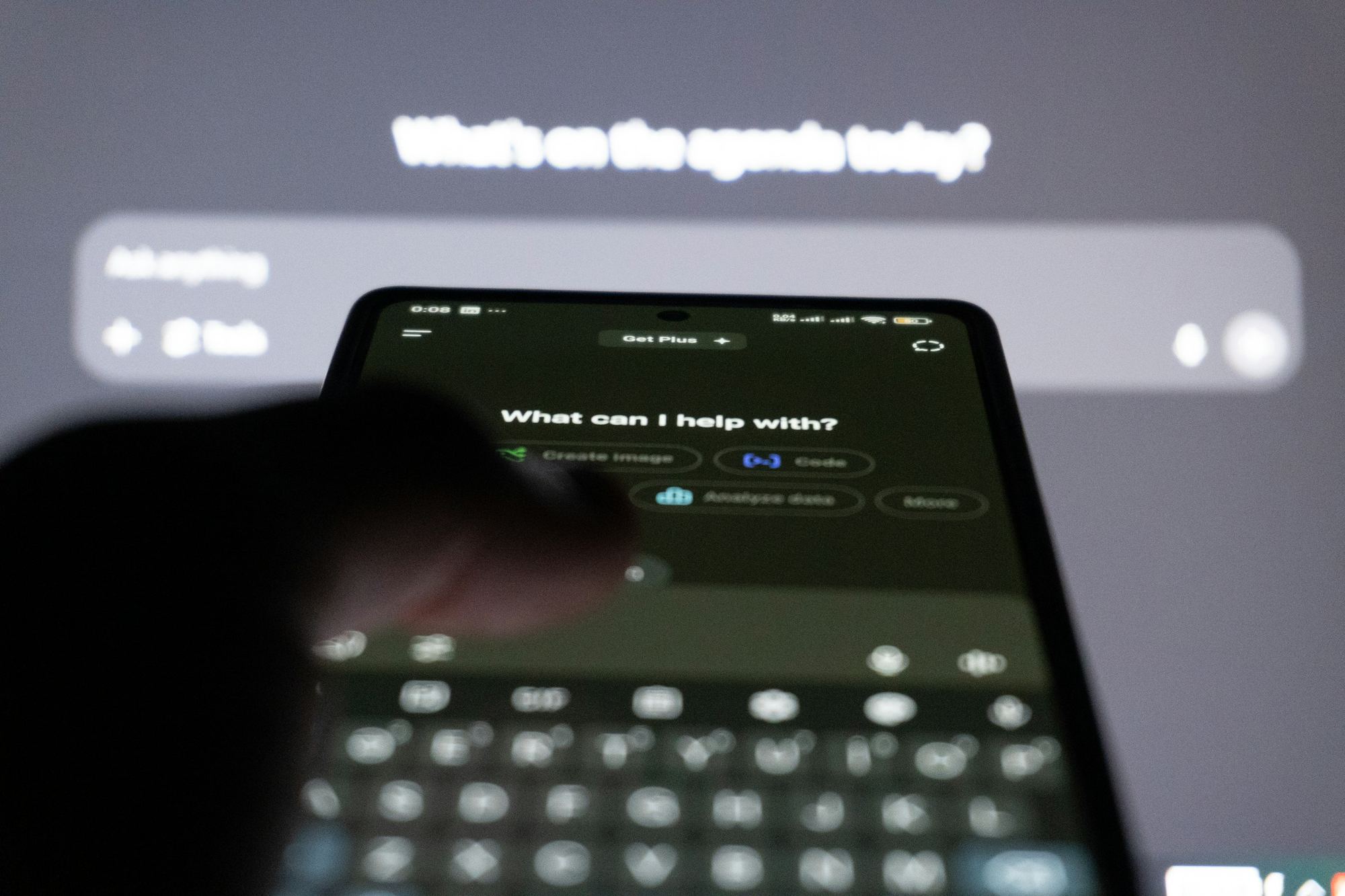 A person typing to an AI assistant on a phone.