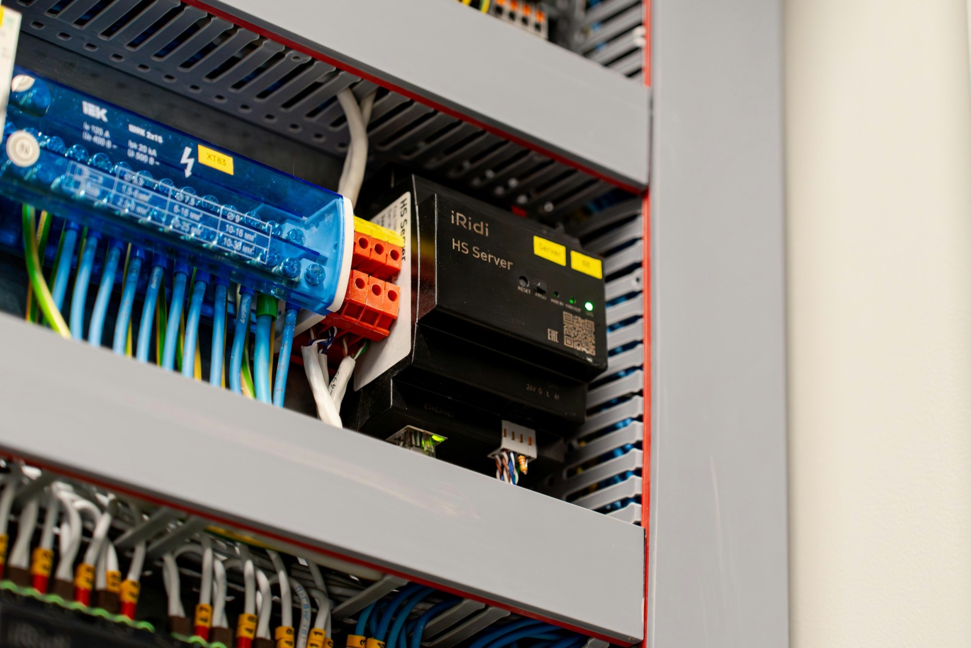 Wired terminal blocks and a controller inside a control panel.